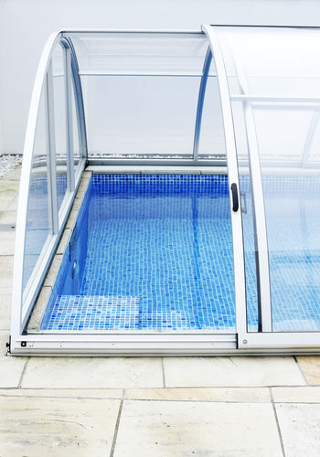 Mid-high swimming pool enclosure - STELLA COMFORT - Gullberg & Jansson AB - sliding / aluminum / motorized