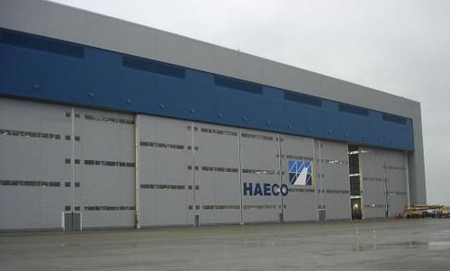 Sliding industrial door - ESAVIAN : TYPE 126 - Jewers Doors - steel / waterproof / for hangar