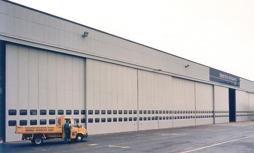 Sliding industrial door - ESAVIAN : TYPE 127 - Jewers Doors - steel / insulated / for hangar