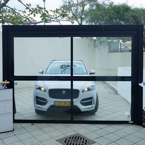 Folding patio door - FULL GLASS - Delta Overlap - galvanised steel / double-glazed / security