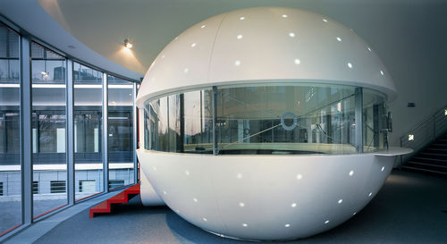 Round reception desk - BALL - AMOS DESIGN - Corian®
