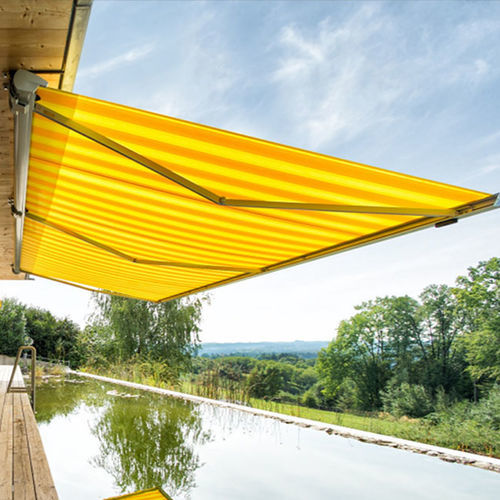 Retractable awning - Trendline - Van Hoof - motorized / patio / yellow