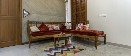 Contemporary table - KAROVY - ALANKARAM - teak / brass / teak base