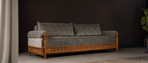 Modern sofa - KLAS - ALANKARAM - fabric / with armrests / cushion