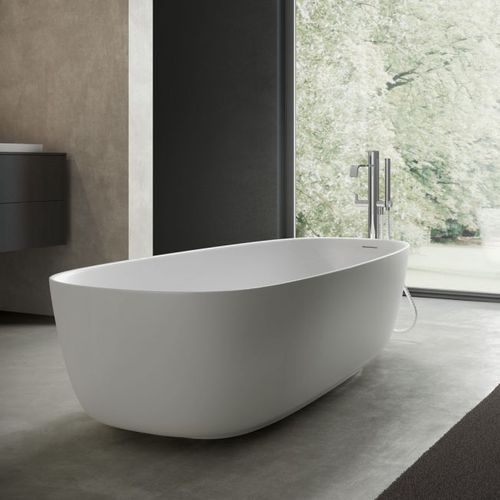 Oval bathtub - RIVER - Disenia - free-standing / for homes / composite