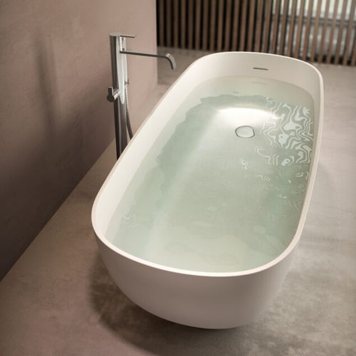Oval bathtub - OVAL - Disenia - free-standing / for homes / composite