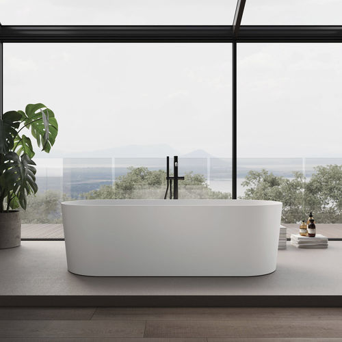 Oval bathtub - DELUXE - Disenia - free-standing / for homes / composite