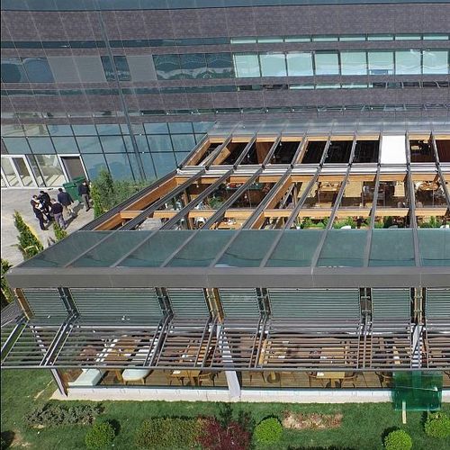 Aluminum glass roof - SOLAGLIDE - Evergreen Solutions - steel / motorized / double-glazed