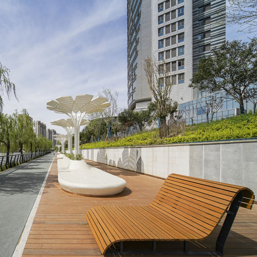 Contemporary public bench - EL - dasso - solid wood / bamboo / with backrest