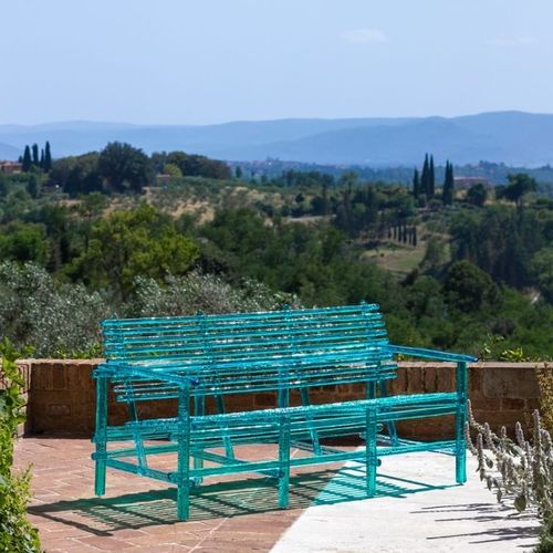 Contemporary garden bench - A'MARE - edra - polycarbonate / with backrest / with armrests