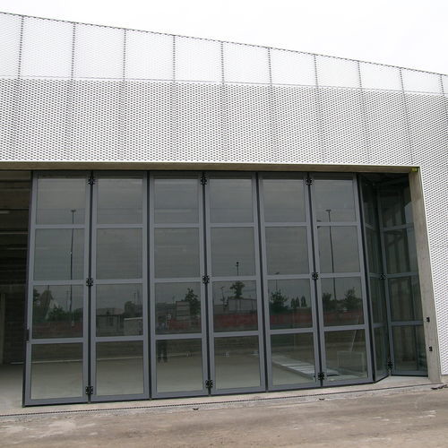 Industrial folding door - FOLDING GLASS - Moreschi Chiusure Industriali S.r.l. - fold-up / steel / galvanised steel