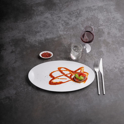 Flat plate - Saturno Elliptical - COSTA VERDE - elliptical / porcelain / commercial