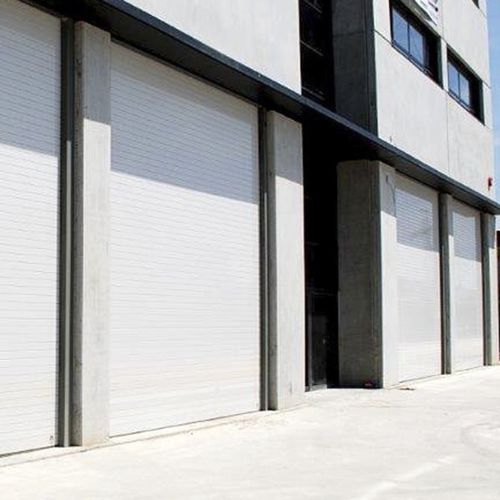 Sectional industrial door - EST&Aacute;NDAR - Manusa - polyurethane / steel / insulated