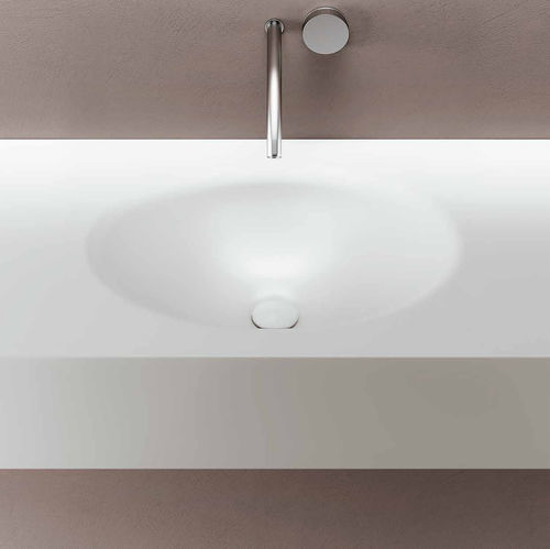 Integrated washbasin - SMOOTH - PLANIT - Corian® / with counter / oval