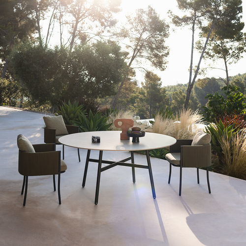 Contemporary dining table - GAMMA 160 - RODA - sandstone / lacquered stainless steel base / round