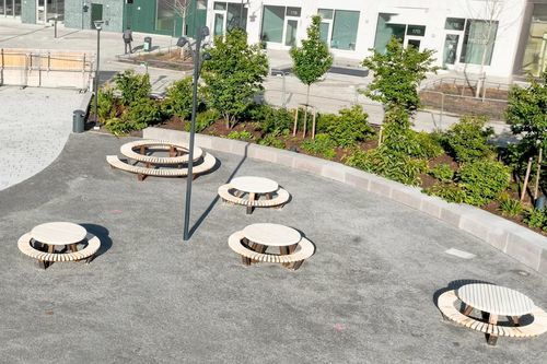 Steel picnic table - SOLID DISC - Streetlife - round / with power hub / for public space