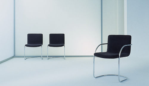 Contemporary chair - LENS - Saporiti Italia - fabric / cantilever / home