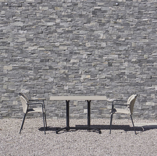Contemporary table - DAKOTA - DRIGANI SRL - HPL / stone / cast iron base