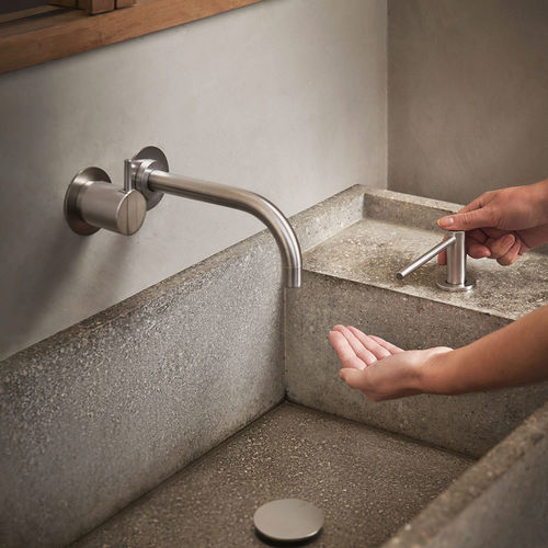Washbasin mixer tap - 111 series - VOLA - wall-mounted / stainless steel / bathroom