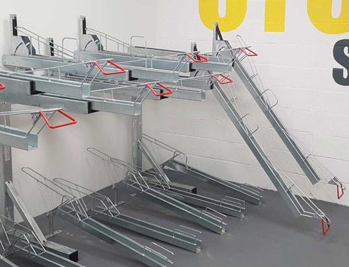 Floor-mounted bike rack - ALOES RED - double-decker / for public space / for parking lot
