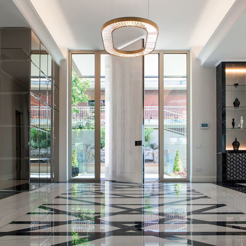 Entry door - SYNUA - Oikos Venezia - marble / ceramic / pivoting