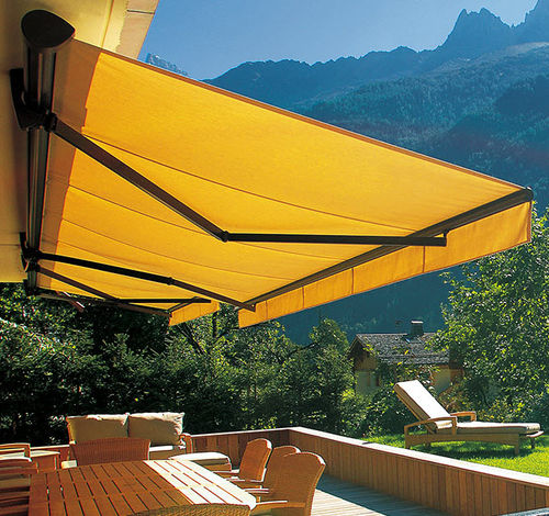 Folding-arm awning - MANUA® - Roche Habitat - semi-box / motorized / patio