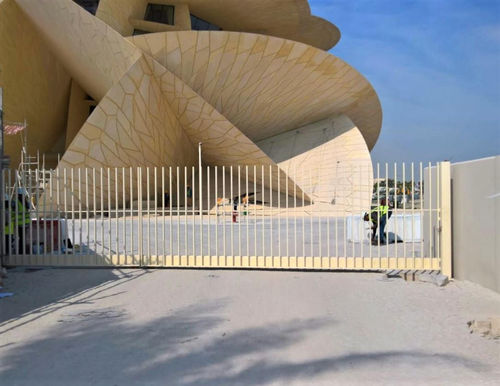 Swing gate - ESTEVA BARCELONA - metal / with bars / motorized