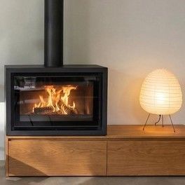 Wood heating stove - AERA - Rüegg Cheminée Schweiz AG - free-standing / central / minimalist design