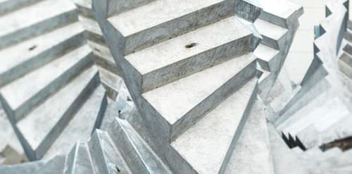 Half-turn staircase - Max Bögl - concrete step / metal frame / technical