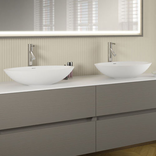 Countertop washbasin - AVELLA - RIHO - Solid Surface / oval / contemporary