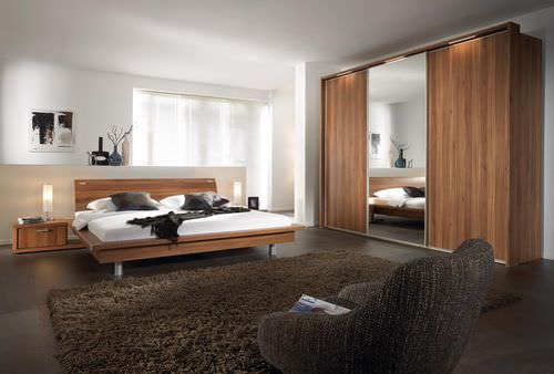 Contemporary wardrobe - RAVENNA - Nolte - wooden / sliding door