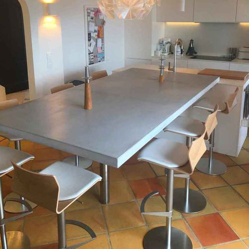 Contemporary dining table - BALIAN BETON Atelier - Ductal® UHP concrete / steel / stainless steel