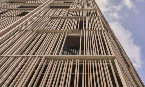 Facade trellis - SLIDING SYSTEM - Grupo GUBIA - 316 stainless steel / solid wood / with wooden cladding