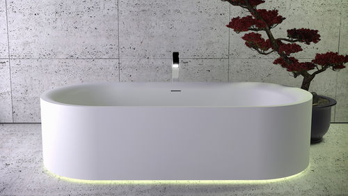 Oval bathtub - MOON - KNIEF & CO. GmbH - free-standing / Solid Surface / white