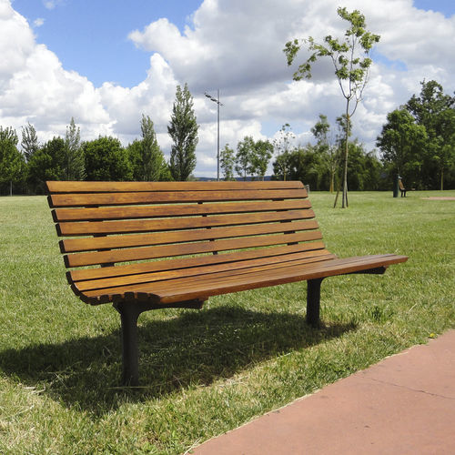 Contemporary public bench - AXIS - LARUS DESIGN - wooden / cast iron / with backrest