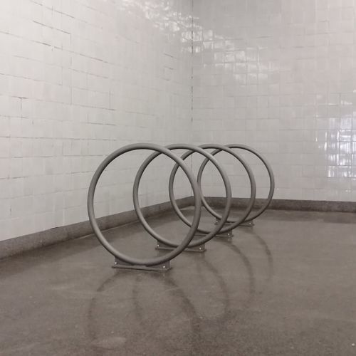 Floor-mounted bike rack - OMEGA - LARUS DESIGN - secure / for public space / steel