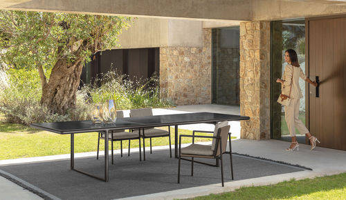 Contemporary dining table - TRESS&Eacute; - TALENTI - sandstone / lava / aluminum base