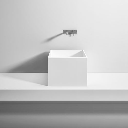 Countertop washbasin - Rexa Design - Corian® / with mixer tap / custom
