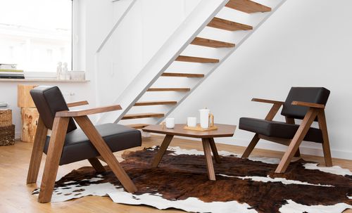 Contemporary armchair - CLAPP - NOTI - fabric / wooden / commercial
