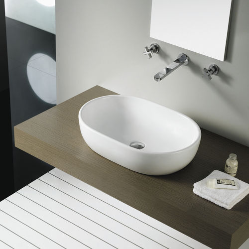 Countertop washbasin - TOULOUSE - Bath Collection S.L. - porcelain / oval / contemporary