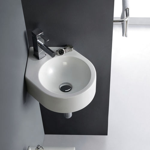 Wall-mounted washbasin - BRISTOL - Bath Collection S.L. - porcelain / corner / contemporary