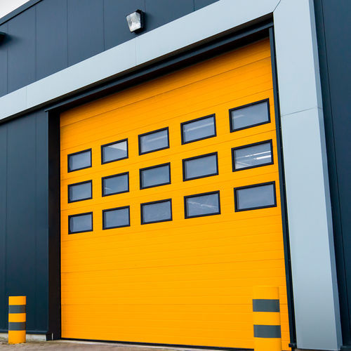 Sectional industrial door - FLEXIDOOR SA - sheet steel / automatic / wind-proof