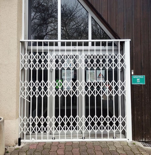 Retractable security grill - DELIAL - La Toulousaine - for doors / for store fronts / galvanised steel