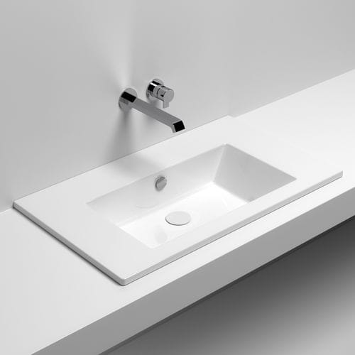 Semi-recessed washbasin - STAR 80 - SIGN - ceramic / with counter / rectangular