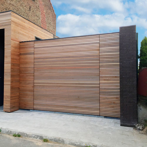 Sectional garage door - AFFLEURANTE - SMF Services - stainless steel / polyurethane foam / automatic