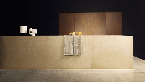 Contemporary kitchen - PETRA - TM Italia - stone / travertine / COR-TEN® steel