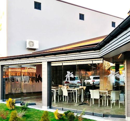 Sliding and stacking patio door - MOMENTUM - ALBERT GENAU - aluminum / security / acoustic