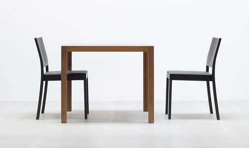 Contemporary restaurant chair - ST3N - HUSSL - wooden / stackable / with armrests