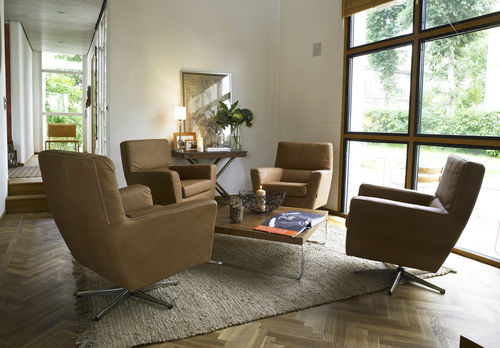 Contemporary armchair - COOPER - Furninova AB - leather / fabric / central base