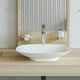 washbasin with mixer tap / countertop / ceramic / curved